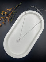 Crystal Whirl – Sterling Silver Pinwheel Pendant Necklace