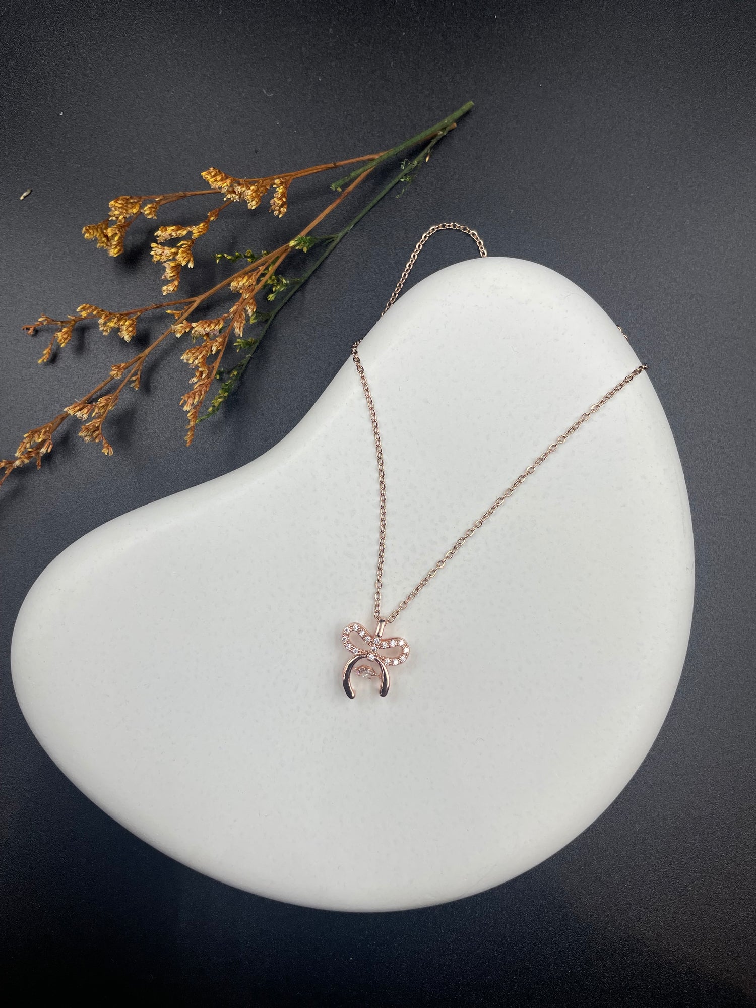 Rose Gold Bow Charm Necklace with Crystal Detailing