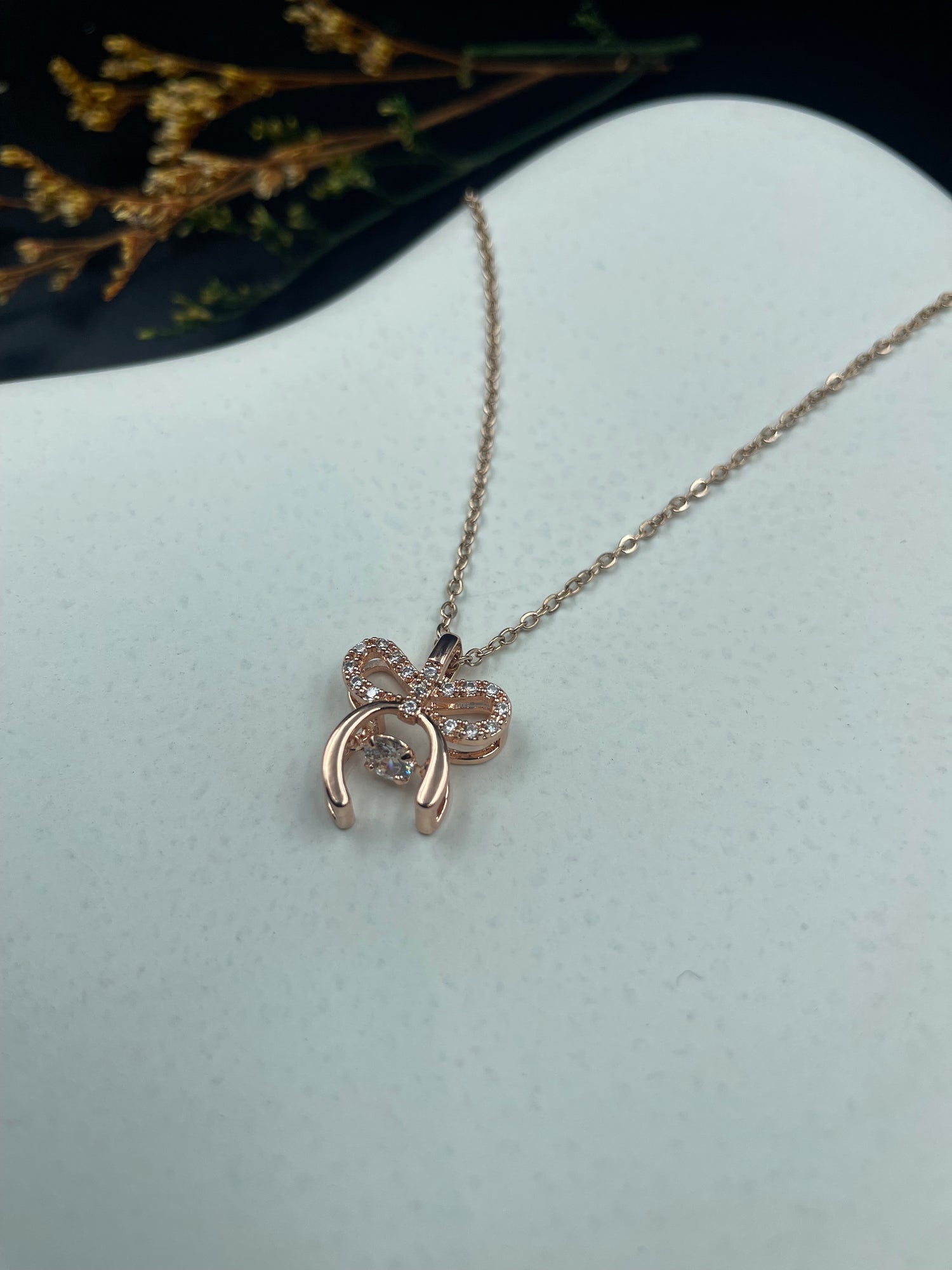 Rose Gold Bow Charm Necklace with Crystal Detailing